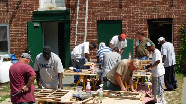 Highly skilled and respected tradesperson Robert Yapp Jr. (top right with glasses) teaching a class at his grass roots “Window Restoration College”