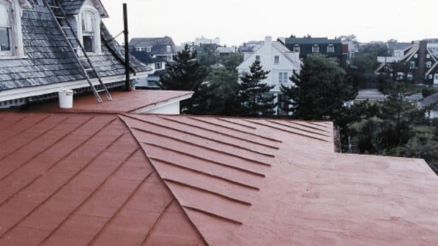 This metal roof has been treated with a waterproofing, elastomeric Acrymax coating from Preservation Products.