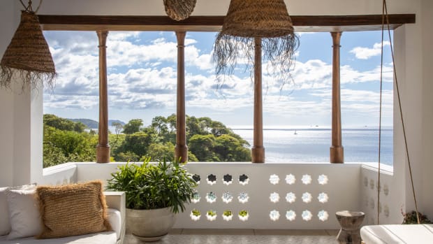 This roof-top porch from Las Catalina, Costa Rica, maximizes views, breezes, and comfort, with a mix of traditional details, local motifs, and textures in the furnishings.
