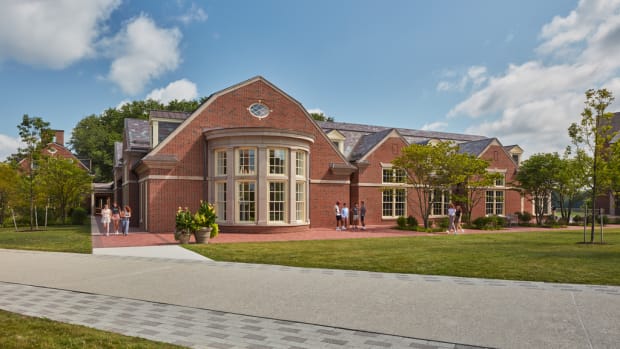 The slate roofs, gambrel roofs, and brick detailing are touchstones of the approach AOS Architects followed while overhauling and adding to the school’s original refectory.