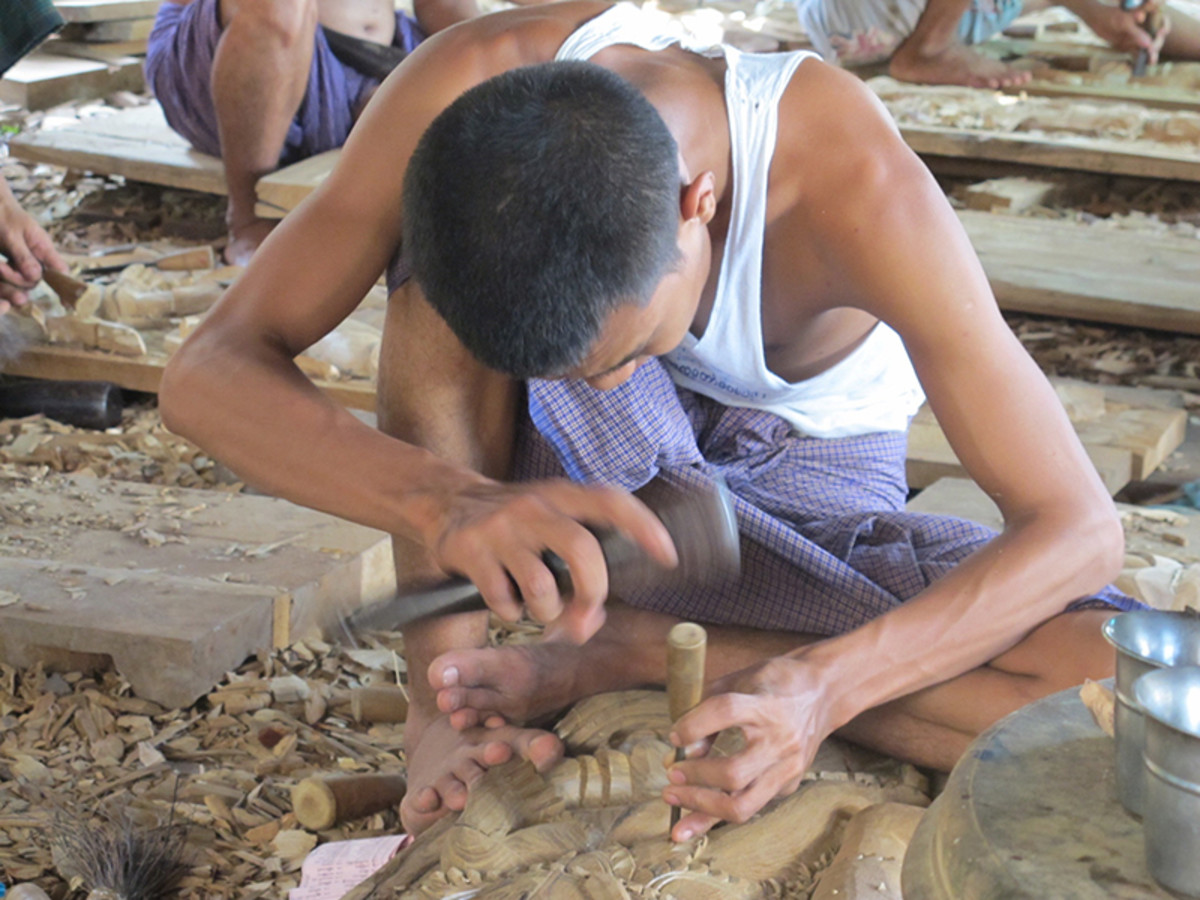 A traditional tradesperson in Mandalay refining his skills in the ancient craft of woodcarving. Unfortunately most of his work is headed for the Chinese hotel chain market. Photo by Laura Saeger