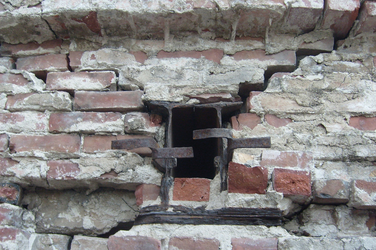 reinforced beams, crumbling brick