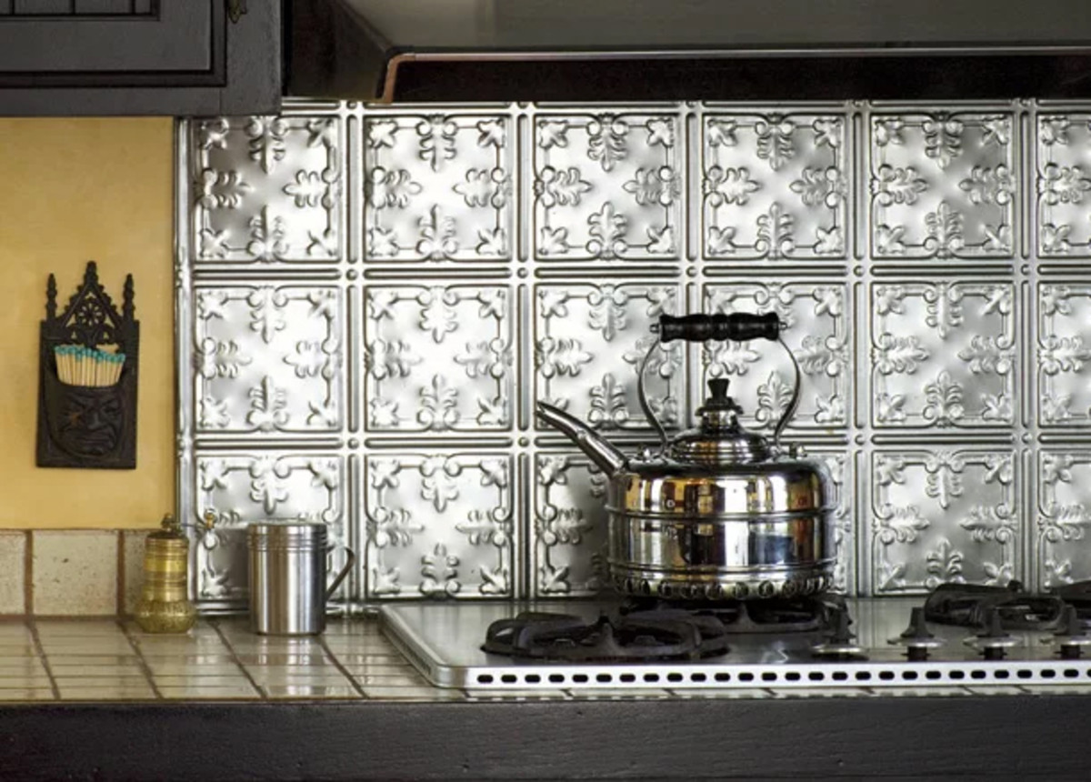This tin backsplash is one of 2019's home decor trends. 