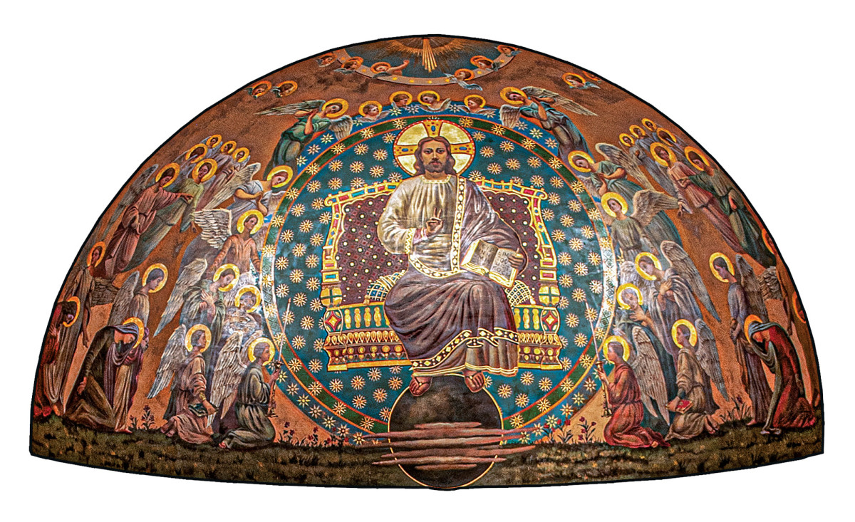 Seated Christ “The Teacher in Heaven” – enthroned – surrounded by angels. In this case the apse mural is the original from 1908. Originally the walls below the windows had a painting of heavy drapery hanging in Romanesque style from a series of bosses.