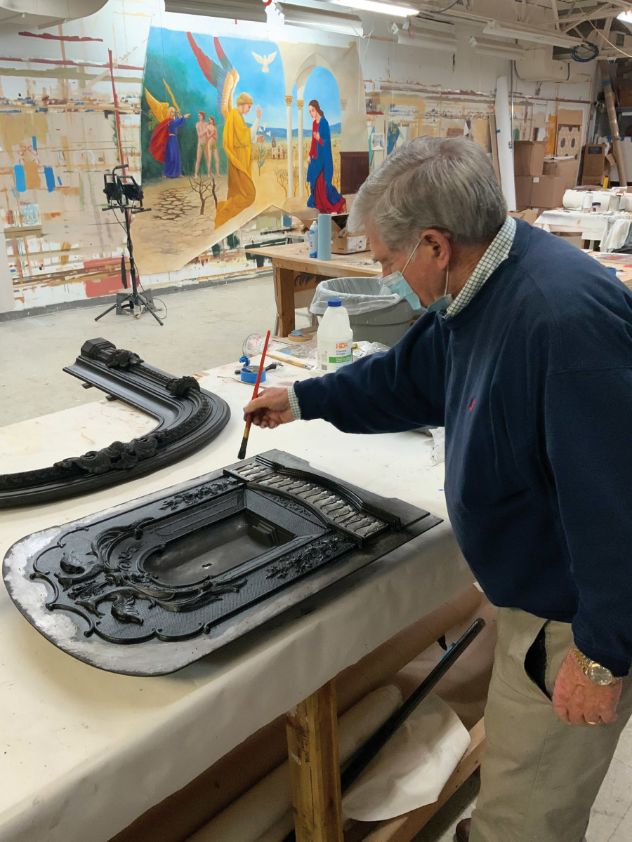 “Black Lead” application being applied to cast-iron surrounds on a marble fireplace by John Canning.