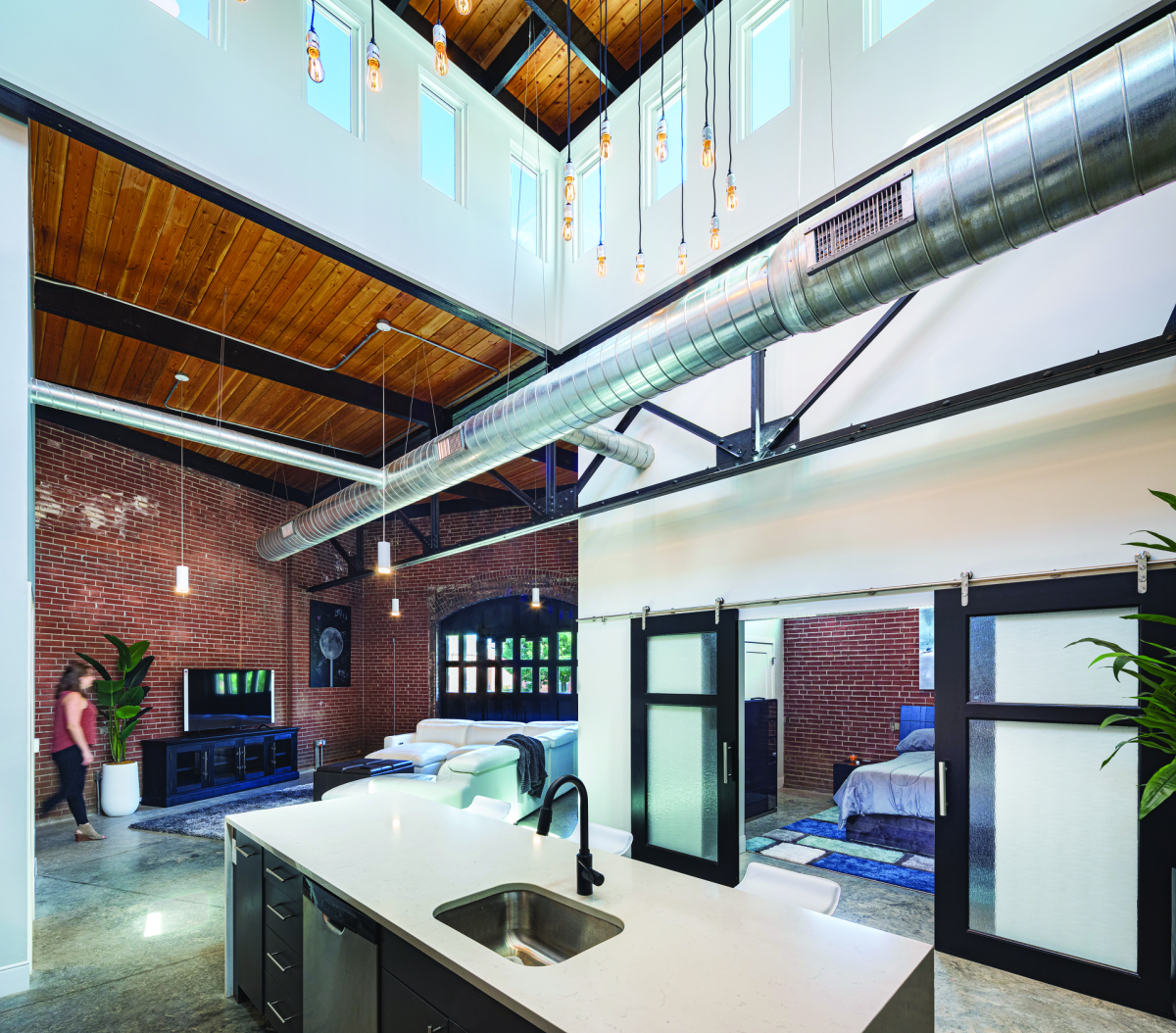 Two loft-like apartments were created in the Garage Building. The original over-wide door opening, where ambulances entered, leads to a private patio. A roof monitor in one unit provides natural light.
