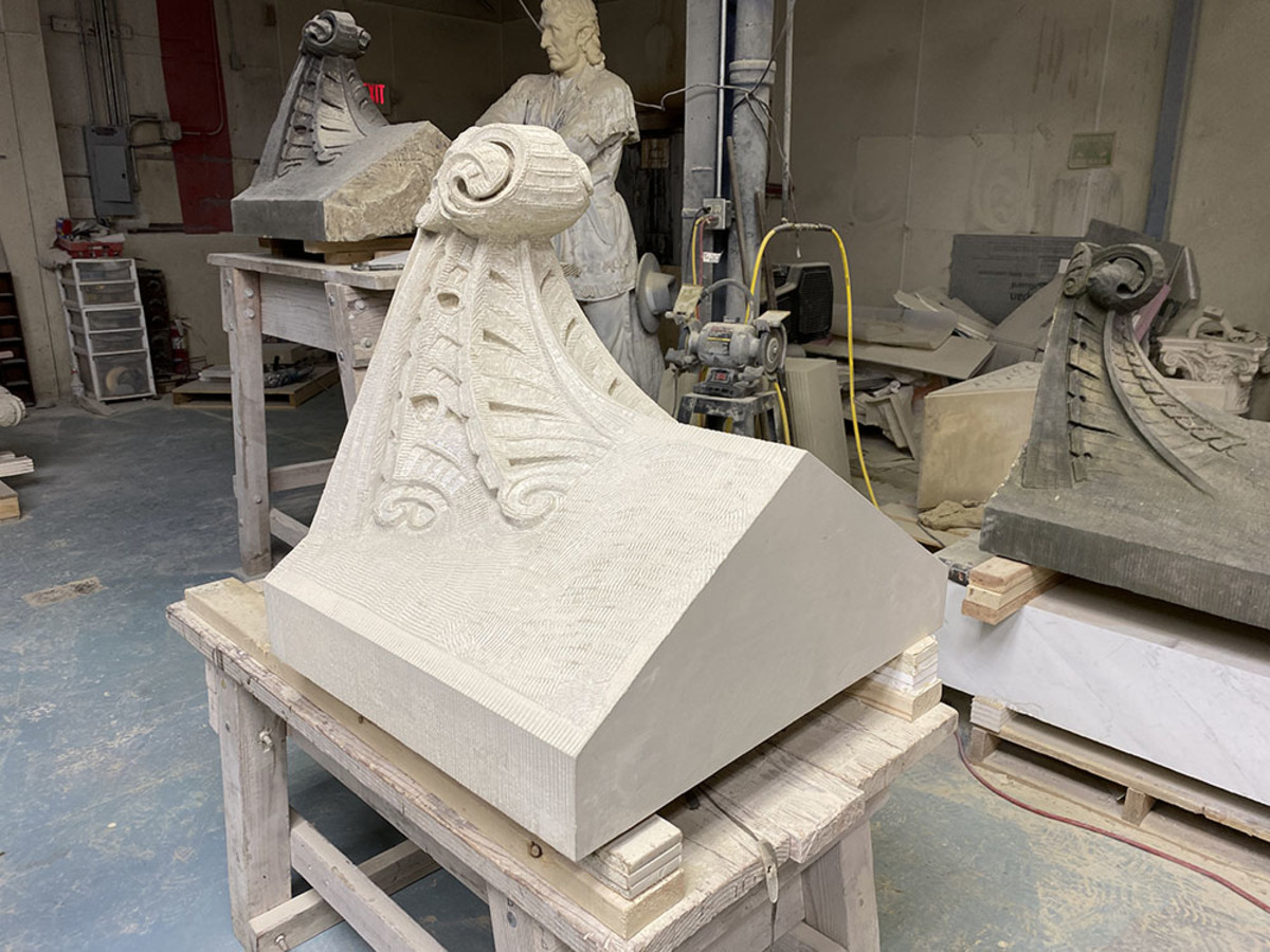 Lost ornaments were carved anew in Berea sandstone both in-studio and in- place, once blocks were attached with steel pins and epoxies. Carvings matched original tooling down to leaving hidden areas less detailed.