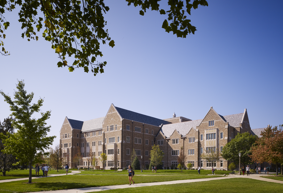 The architectural style, in Collegiate Gothic expression, seamlessly blends with the older buildings on campus, while allowing for modern features such as sustainable technologies.