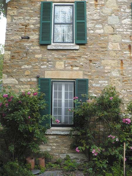 shuttercraft-stone-house-green-shutters.jpg