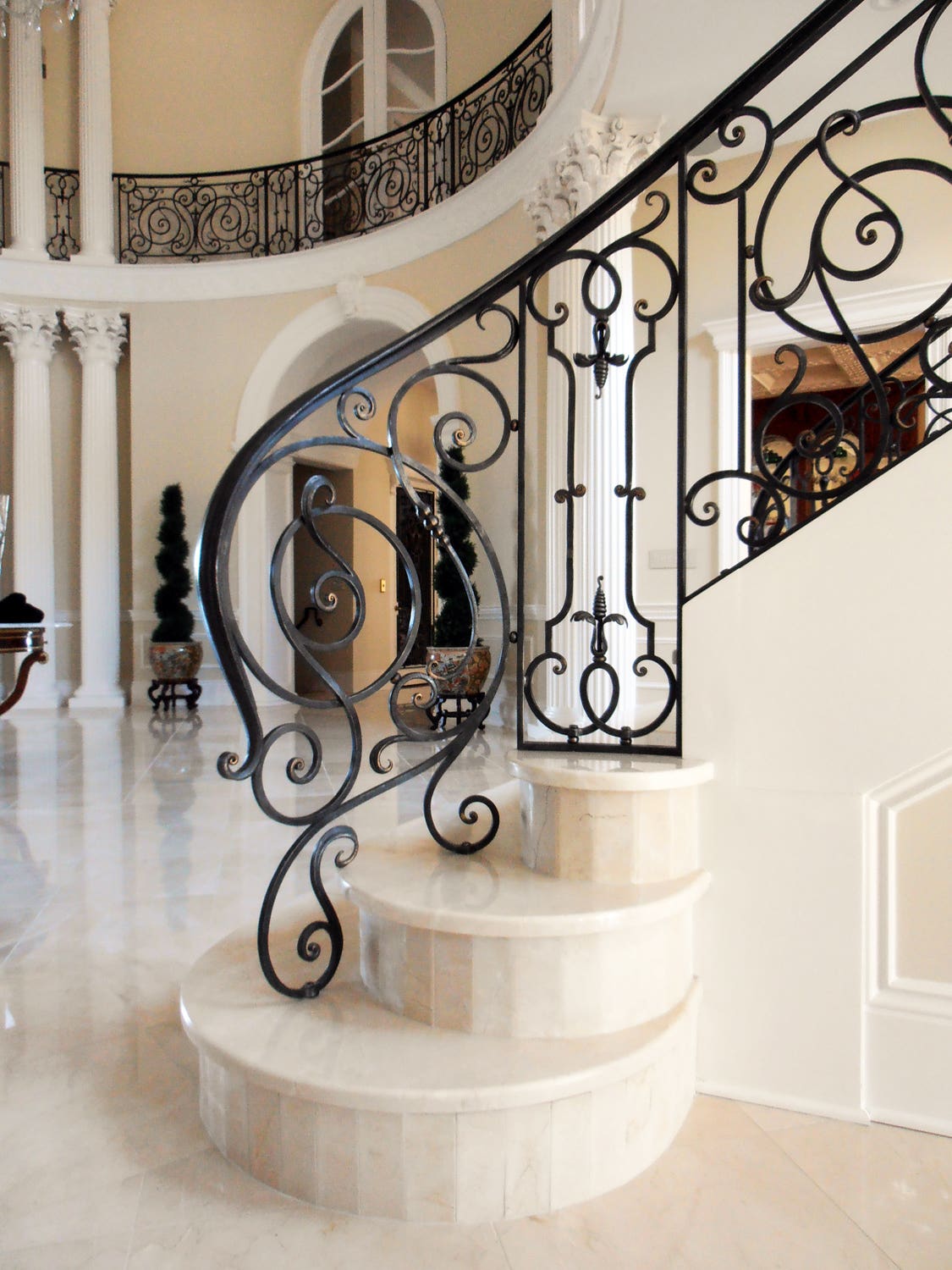 4-ironwork-in-the-artisan-tradition-view-of-stairway-detail-with-hallway-railing-in-the-background.jpg