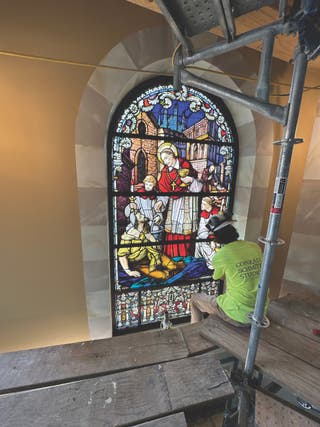 installing-st-charles-borromeo-window-large.jpg